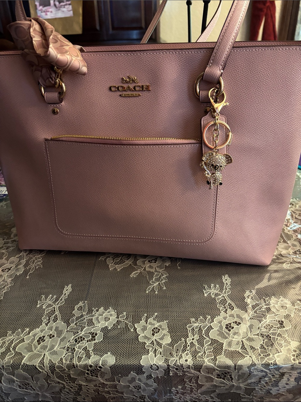 gold-toned handbag charm featuring a a cute  bedazzled koala bear